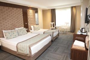Postel nebo postele na pokoji v ubytování Ankara Gold Hotel + 12 fotografií