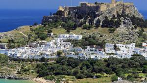 an island with a castle on top of a mountain at Villa Vasilia in Lindos