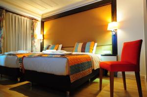 Cama o camas de una habitación en Ottopera Hotel