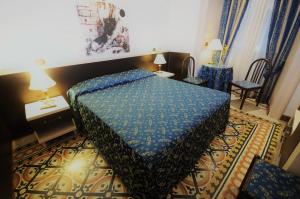 Łóżko lub łóżka w pokoju w obiekcie Hotel Sweet Home