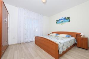 Postel nebo postele na pokoji v ubytování Apartments & Rooms Seaside