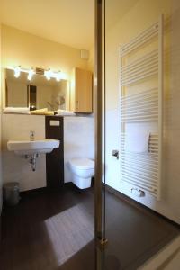 a bathroom with a sink and a toilet at Hotel Waldblick in Treffurt