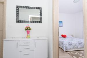 Postel nebo postele na pokoji v ubytování Apartments & Rooms Seaside
