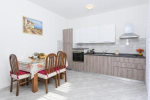 Kuchyň nebo kuchyňský kout v ubytování Apartments & Rooms Seaside