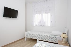TV a/nebo společenská místnost v ubytování Apartments & Rooms Seaside