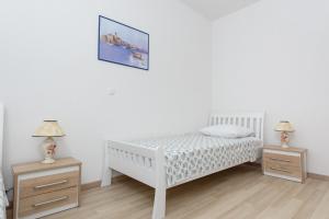 Postel nebo postele na pokoji v ubytování Apartments & Rooms Seaside