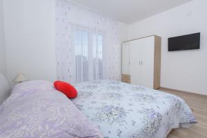 Postel nebo postele na pokoji v ubytování Apartments & Rooms Seaside