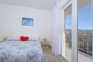 Postel nebo postele na pokoji v ubytování Apartments & Rooms Seaside