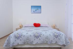Postel nebo postele na pokoji v ubytování Apartments & Rooms Seaside