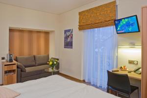 TV a/nebo společenská místnost v ubytování Hotel Ambassador