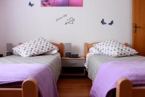 Postel nebo postele na pokoji v ubytování Apartment Nela