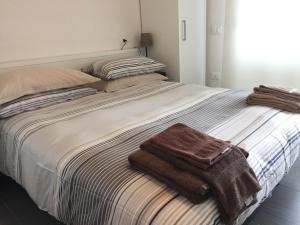 Postel nebo postele na pokoji v ubytování Residence La Nave