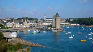 a group of boats in a river in a city at Cosy Solidor Beach View in Saint Malo