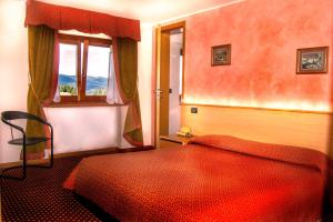 Postel nebo postele na pokoji v ubytování Hotel Belvedere