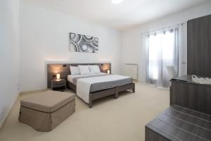 A bed or beds in a room at Villa Lupia