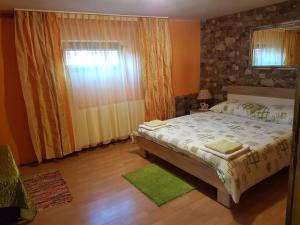 Postel nebo postele na pokoji v ubytování Apartment Tomašević