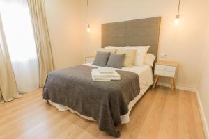 A bed or beds in a room at Apartamento Avenida de Colón con Aire Acondicionado
