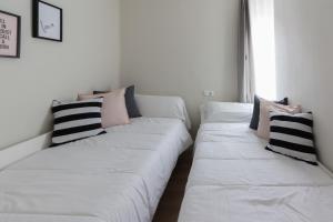 A bed or beds in a room at Apartamento Avenida de Colón con Aire Acondicionado