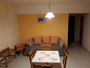 a living room with a couch and a table at Amaryllis Hotel in Karpathos