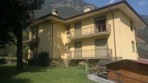 a large building with balconies on the side of it at Champdepraz Casa Vacanze in Champdepraz