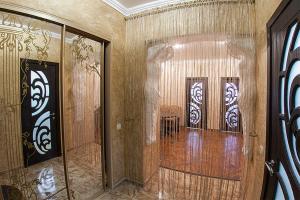 a hallway with two doors in a room at Rynok Square - the heart of Lviv in Lviv