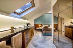 a bathroom with a sink and a bedroom at Apartments Master 5 in Herceg-Novi