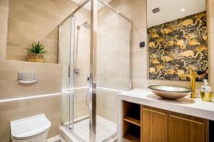 a bathroom with a shower and a sink and a toilet at Apartments Master 5 in Herceg-Novi