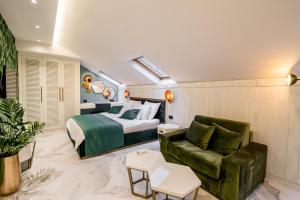 a hotel room with a bed and a couch at Apartments Master 5 in Herceg-Novi