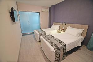 Postel nebo postele na pokoji v ubytování Diamond Inn