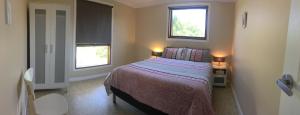 a bedroom with a bed and a window at Swan Valley Sisters in Henley Brook