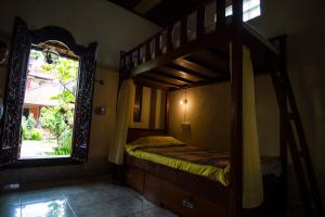 Postel nebo postele na pokoji v ubytování Tunjung Guest House