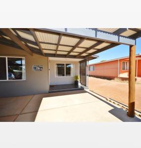 a pergola over a patio of a house at Claire’s Place in Kalbarri