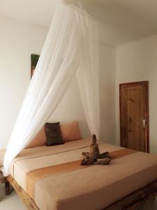 Postel nebo postele na pokoji v ubytování Sammy Homestay