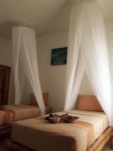 Postel nebo postele na pokoji v ubytování Sammy Homestay
