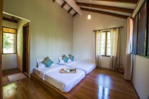 Katil atau katil-katil dalam bilik di Rest Pause Rainforest Retreat