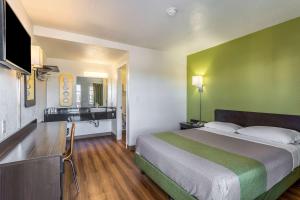 a hotel room with a bed and a bathroom at Motel 6-El Paso, TX - East in El Paso