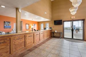 a large room with a large counter with a tv at Rodeway Inn in Santa Rosa