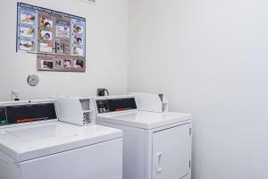 a laundry room with two washers and a washing machine at Motel 6-Newport, OR in Newport +32 photos