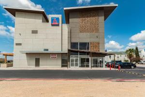 a building with a sign on the side of it at Studio 6 New Braunfels, Tx in New Braunfels