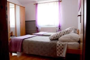 Postel nebo postele na pokoji v ubytování Apartment Nela