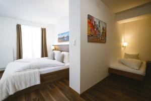 Postel nebo postele na pokoji v ubytování Hotel Römerhof
