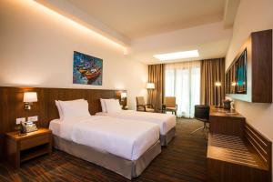 Ένα ή περισσότερα κρεβάτια σε δωμάτιο στο Citea Apart Hotel