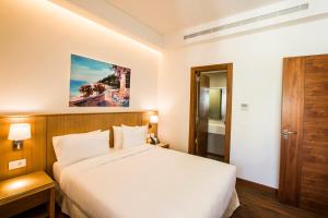Ένα ή περισσότερα κρεβάτια σε δωμάτιο στο Citea Apart Hotel