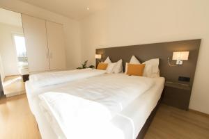 Postel nebo postele na pokoji v ubytování Vitus Steyr Hotel & SPA Suites