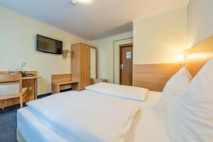 Postel nebo postele na pokoji v ubytování Hotel Windsor