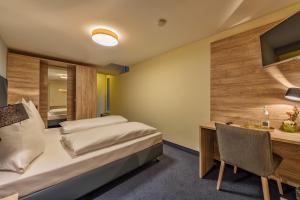 Postel nebo postele na pokoji v ubytování Hotel Windsor