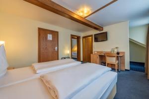 Postel nebo postele na pokoji v ubytování Hotel Windsor