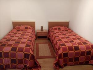 Łóżko lub łóżka w pokoju w obiekcie Apartments Villa Fernetich