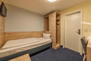 Postel nebo postele na pokoji v ubytování Hotel Windsor