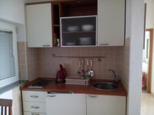 Kuchyň nebo kuchyňský kout v ubytování Apartments Villa Fernetich + 37 fotografií